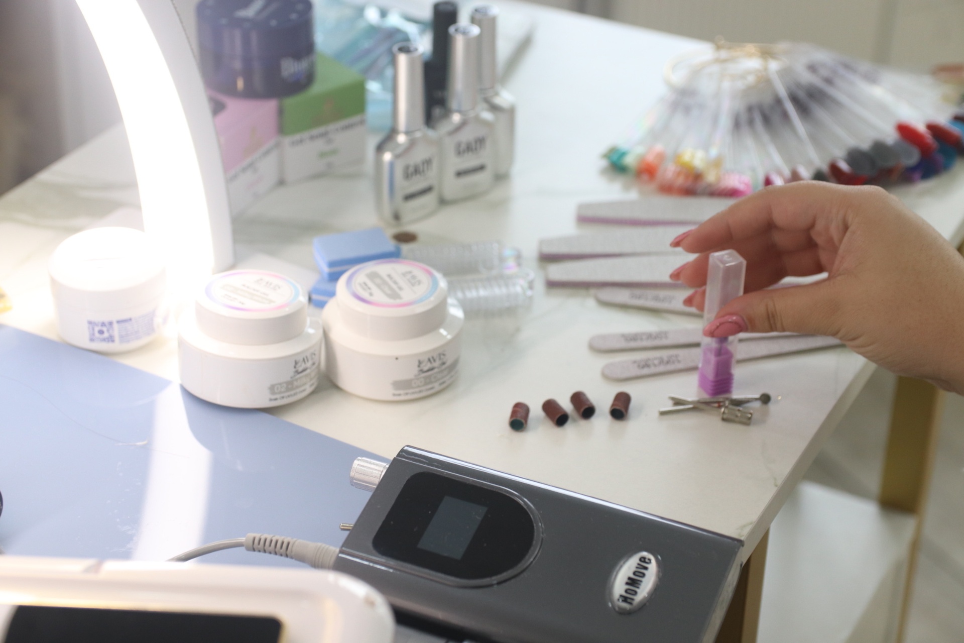 Nail technician station with professional equipment